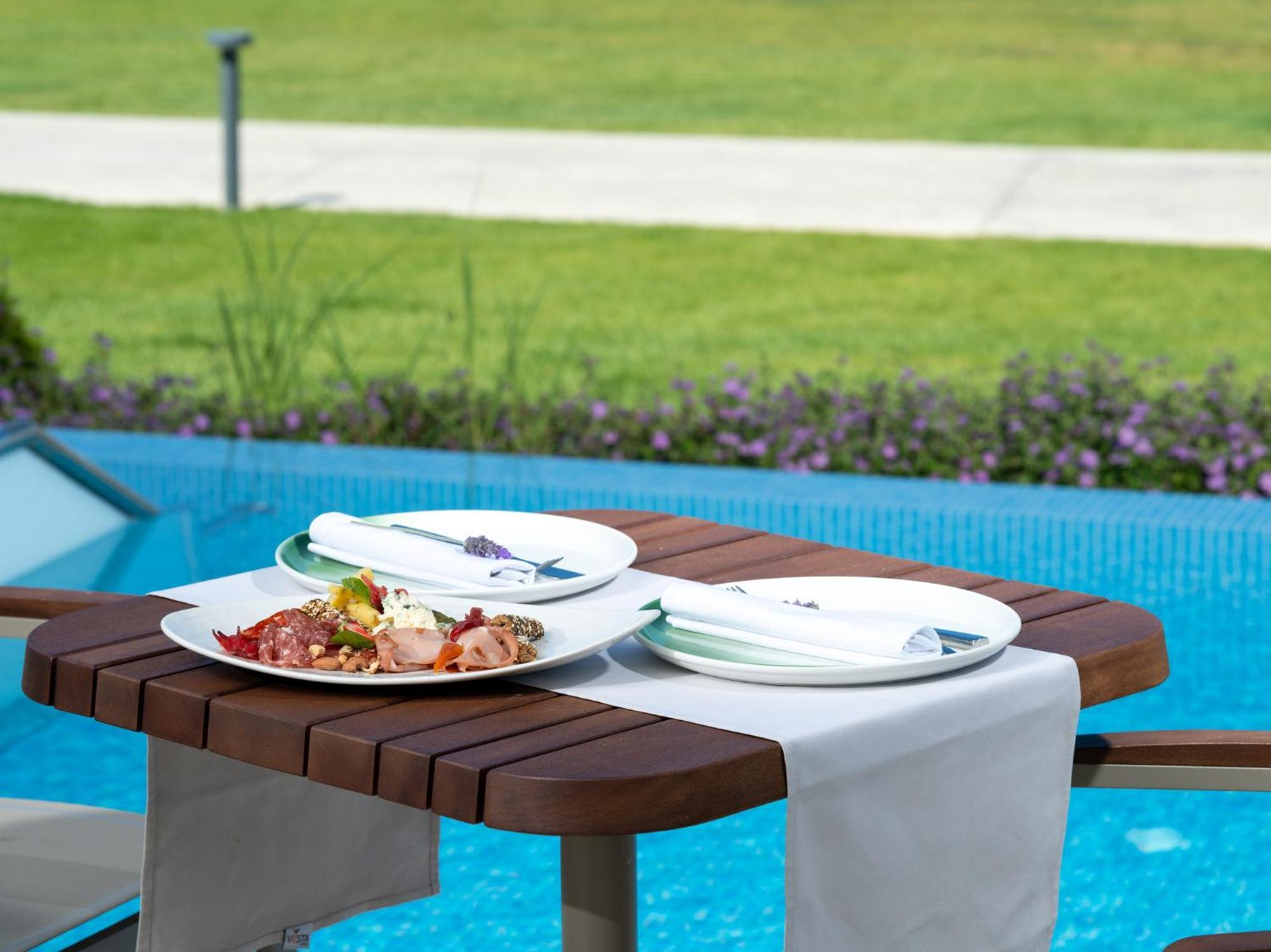 Ammoa Luxury Hotel & Spa Resort Nikiti  Exterior photo A table with a table runner